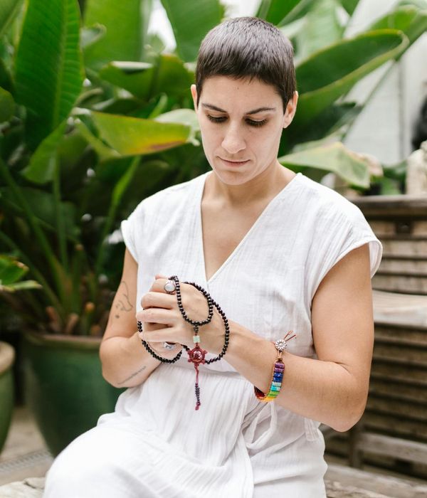 Woman practicing mindful gaze relaxation in a peaceful garden setting